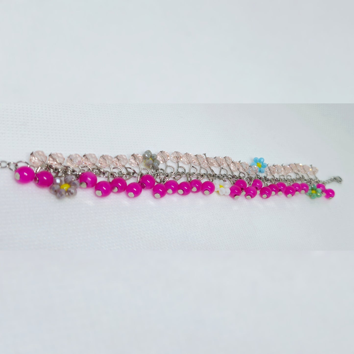 Roze cluster armbandje met bloemen