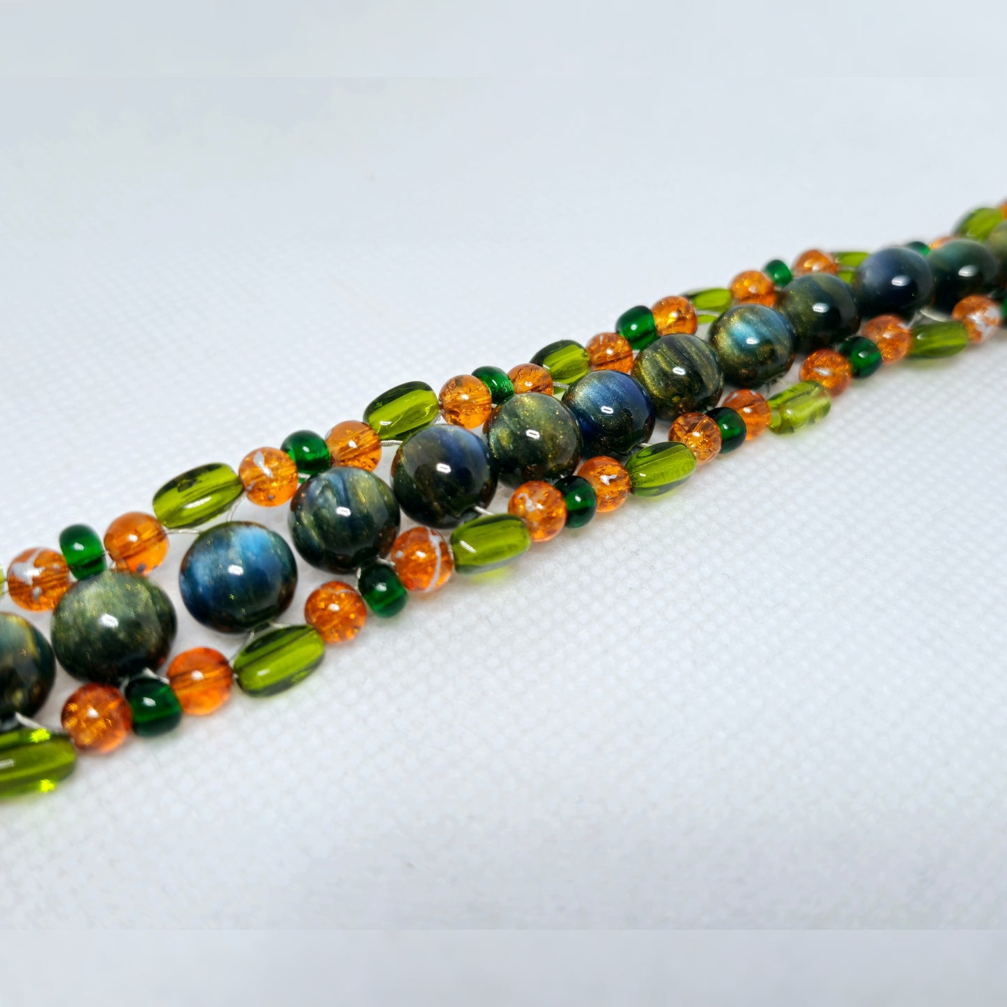 Handmade - groen/oranje vlecht