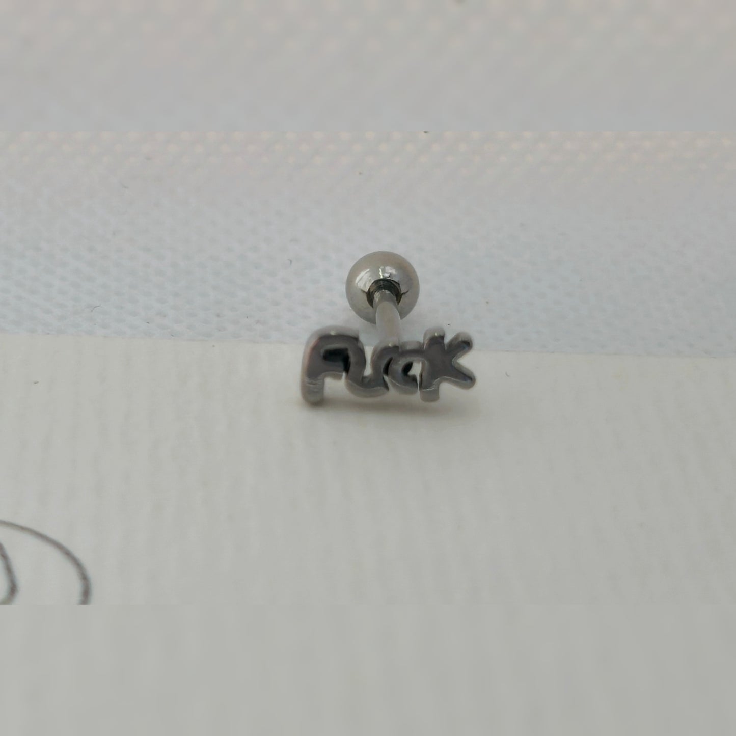 Tong piercing - F*CK
