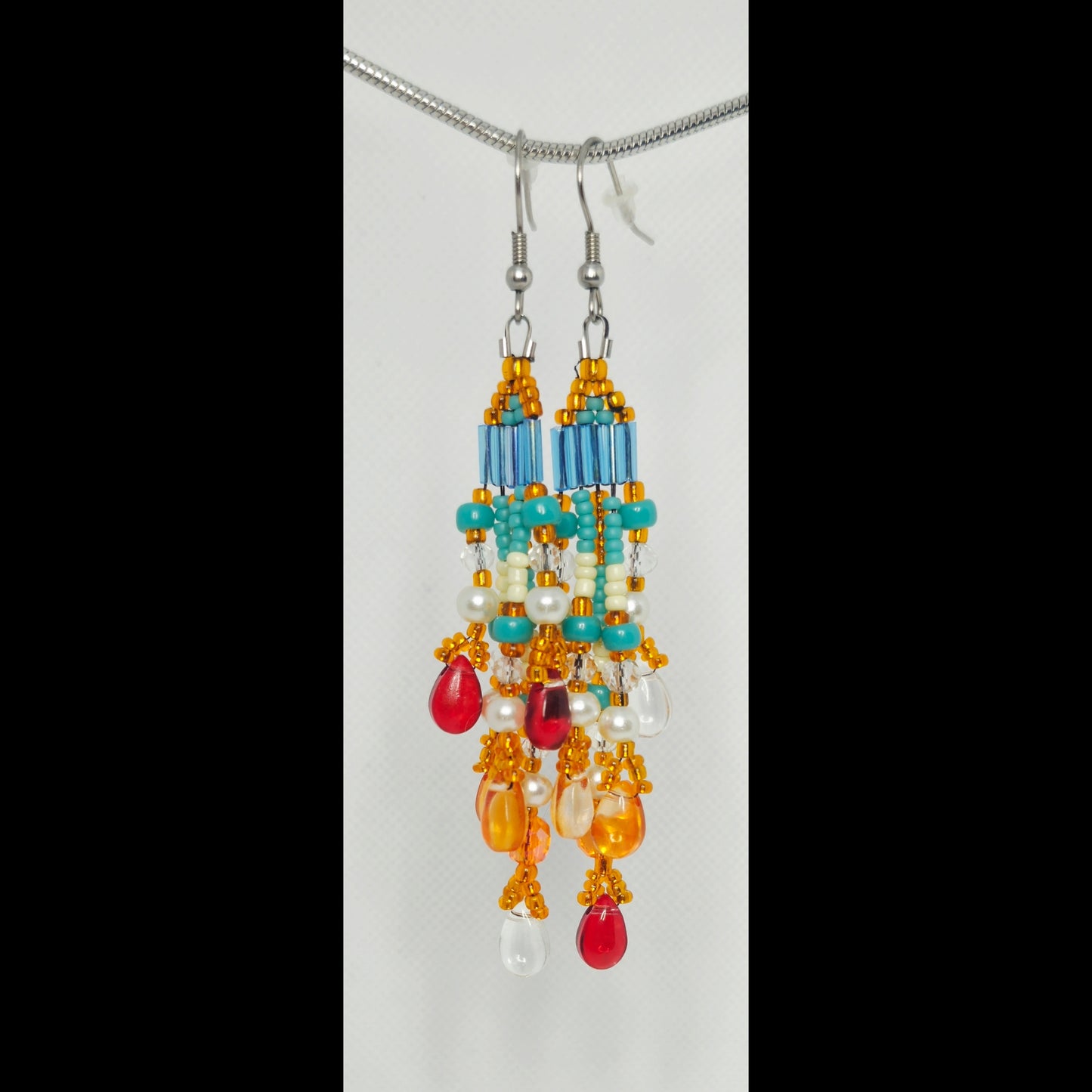 Statement oorbellen oranje/turquoise