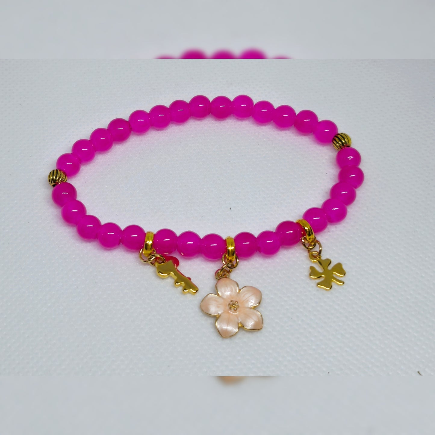 Armband roze met goudkleur