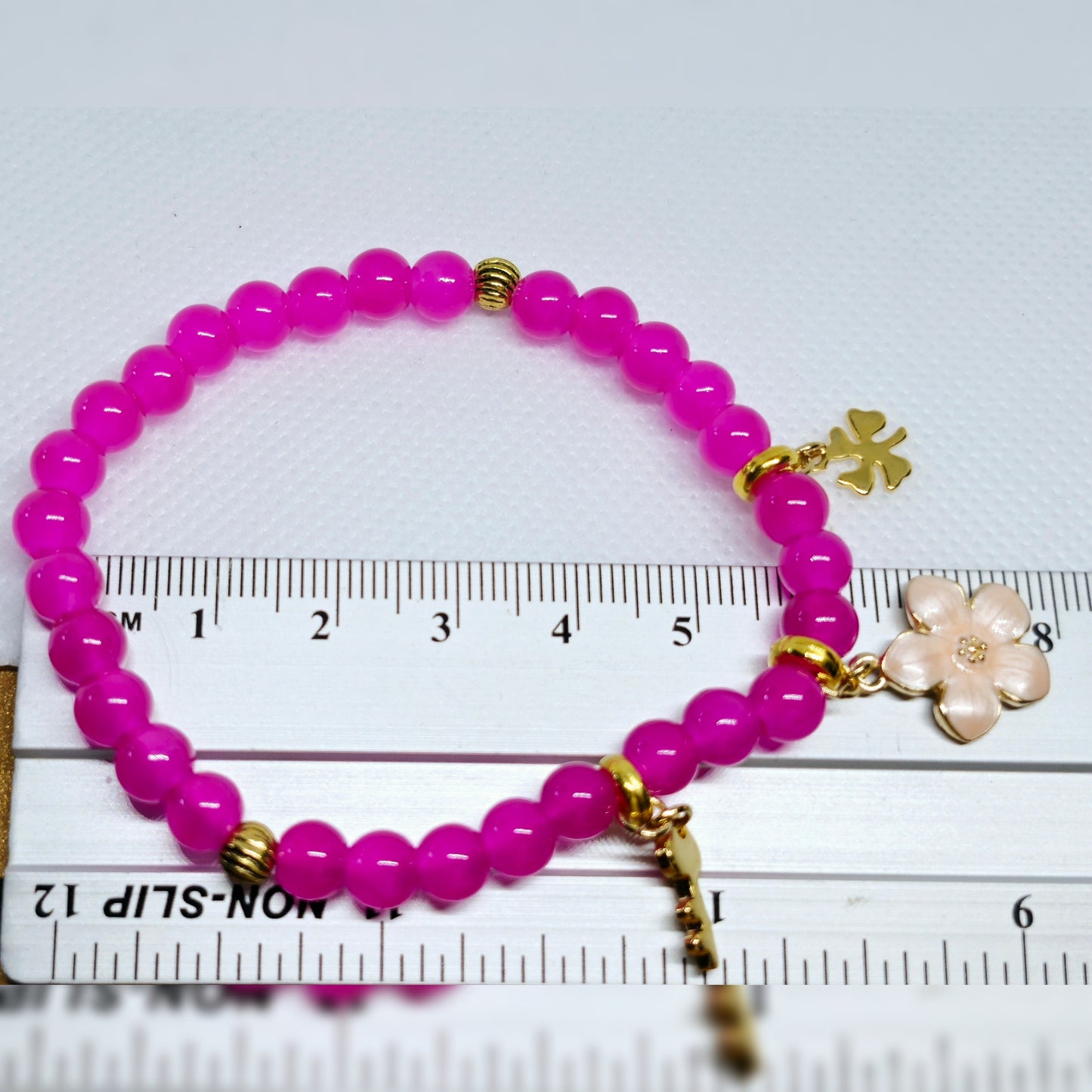 Armband roze met goudkleur