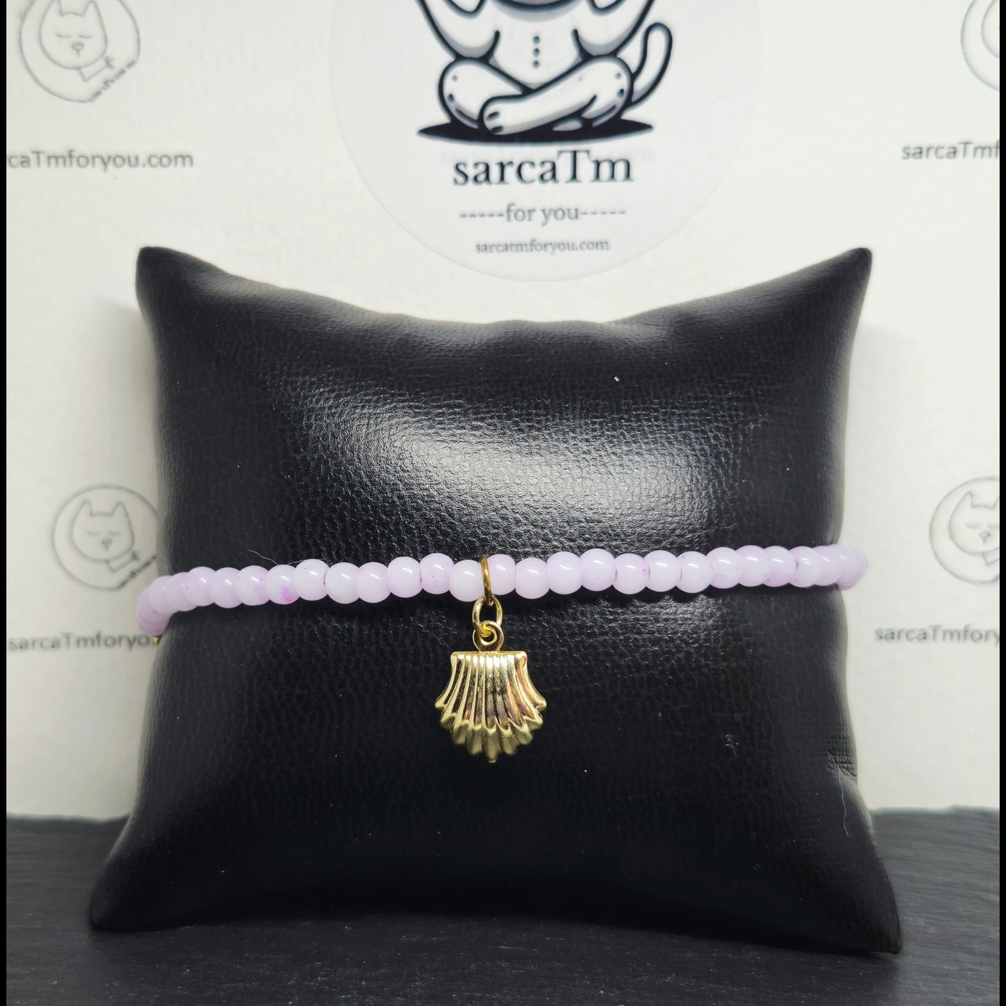 Roze armband met schelp