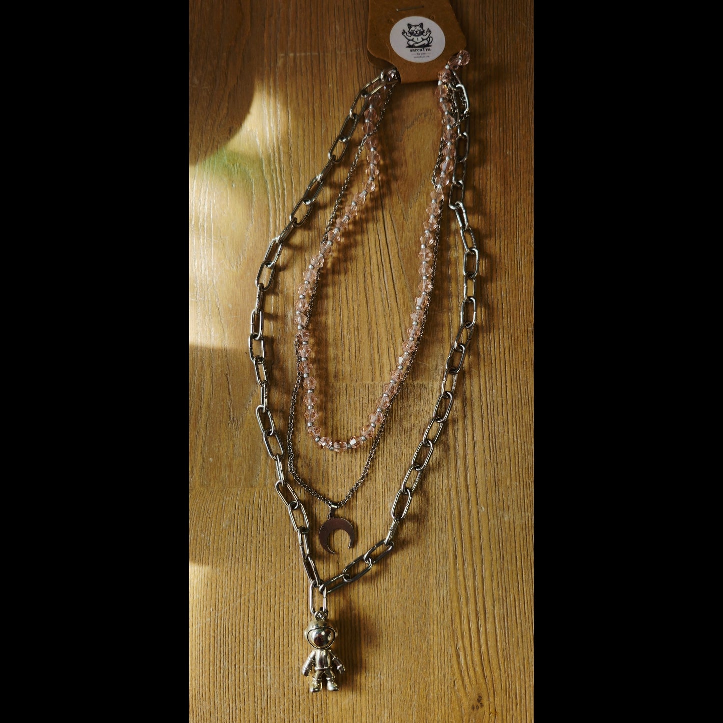 Drie-laagse ketting astronaut